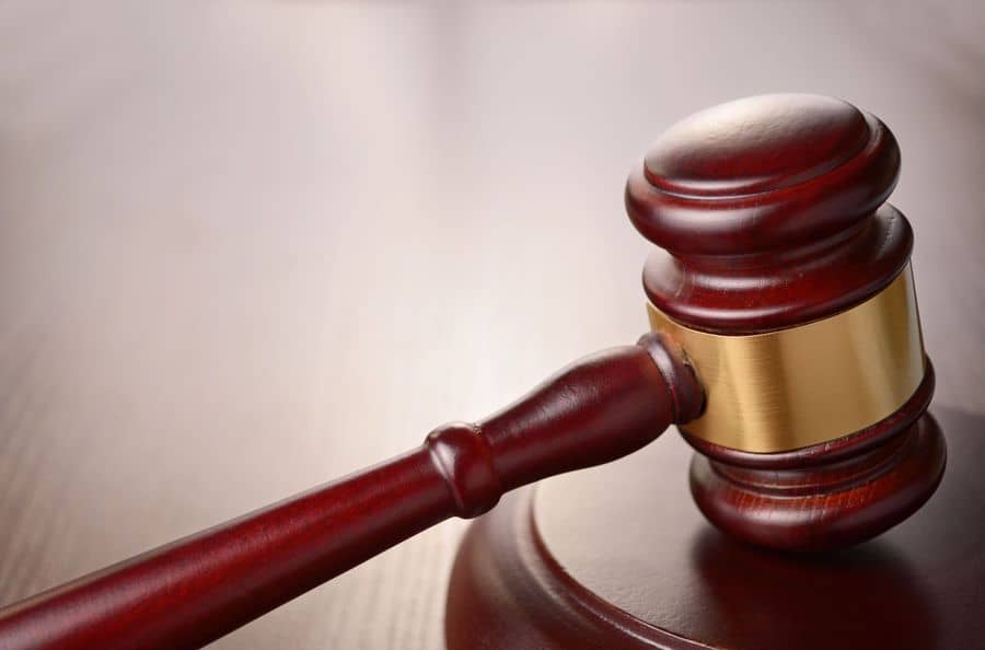 judges gavel on a brown table
