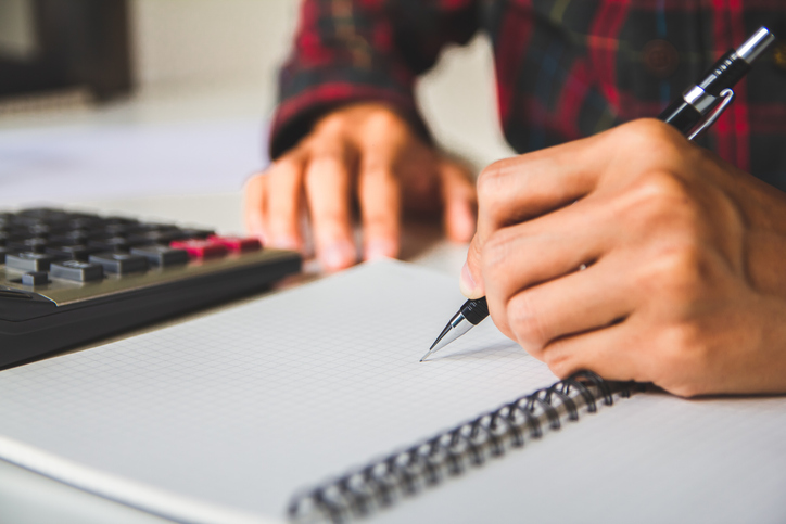 writing report bonus(Or other compensation) to employees to increase productivity, work from home, quarantine. Selective Focus
