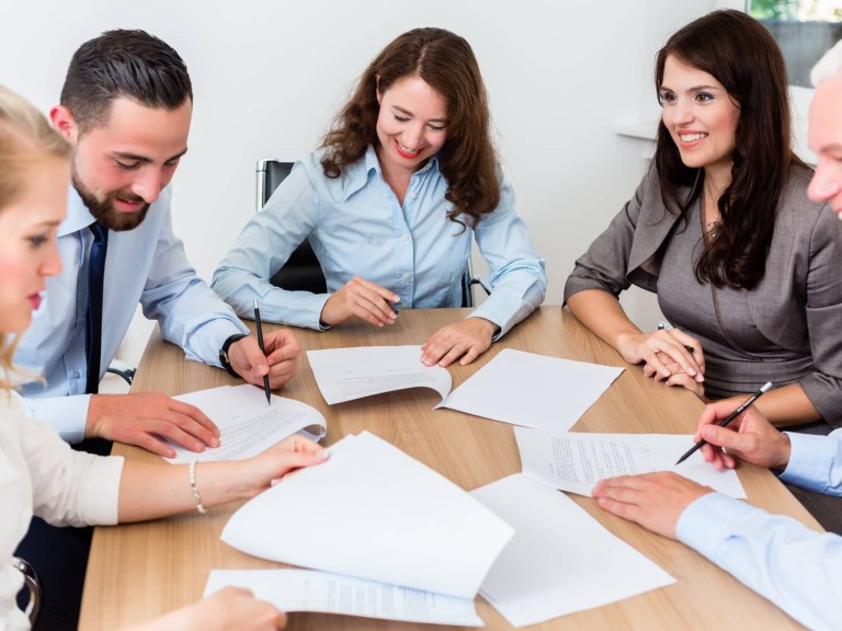 Lawyers having team meeting in law firm