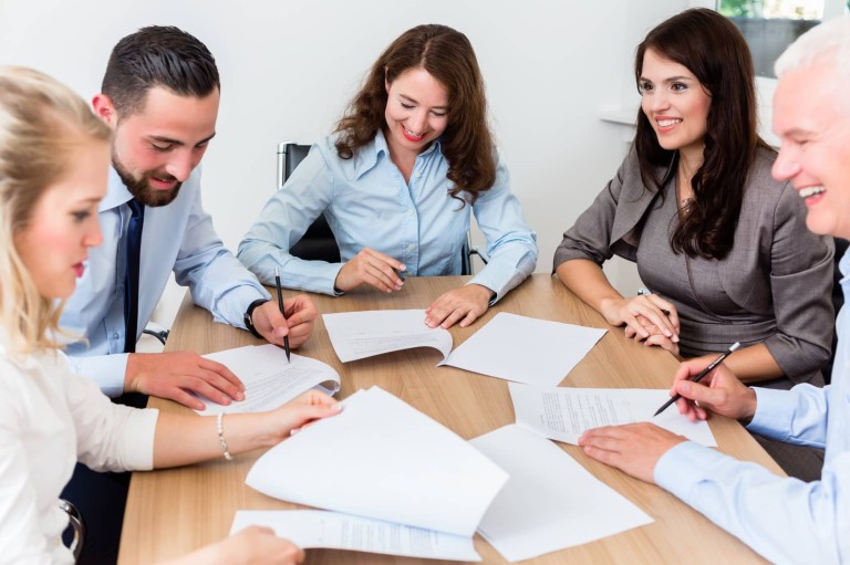 Lawyers having team meeting in law firm