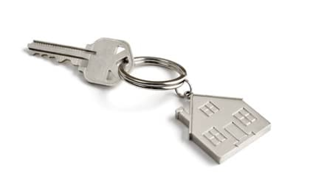 metal key with house key ring