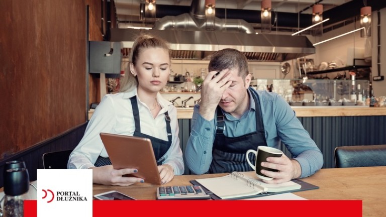 Depressed two entrepreneurs man and woman inside their restaurant overwhelmed by finance problems