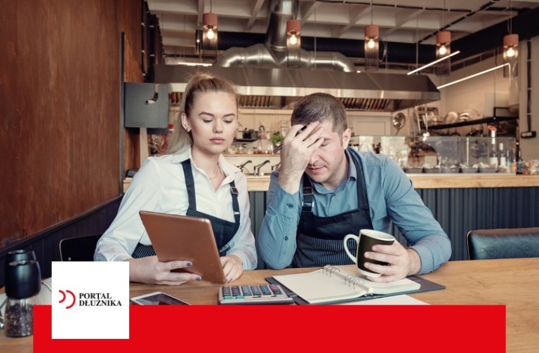 Depressed two entrepreneurs man and woman inside their restaurant overwhelmed by finance problems