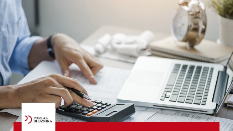 young man holding pen working on calculator to calculate business data, taxes, bills payment, Start up counting finance.accounting, statistics, and analytic research concept