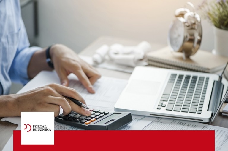 young man holding pen working on calculator to calculate business data, taxes, bills payment, Start up counting finance.accounting, statistics, and analytic research concept